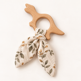 Anneau de dentition dinosaure en bois naturel avec lien en tissu fleuri